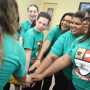 a group of women in a huddle